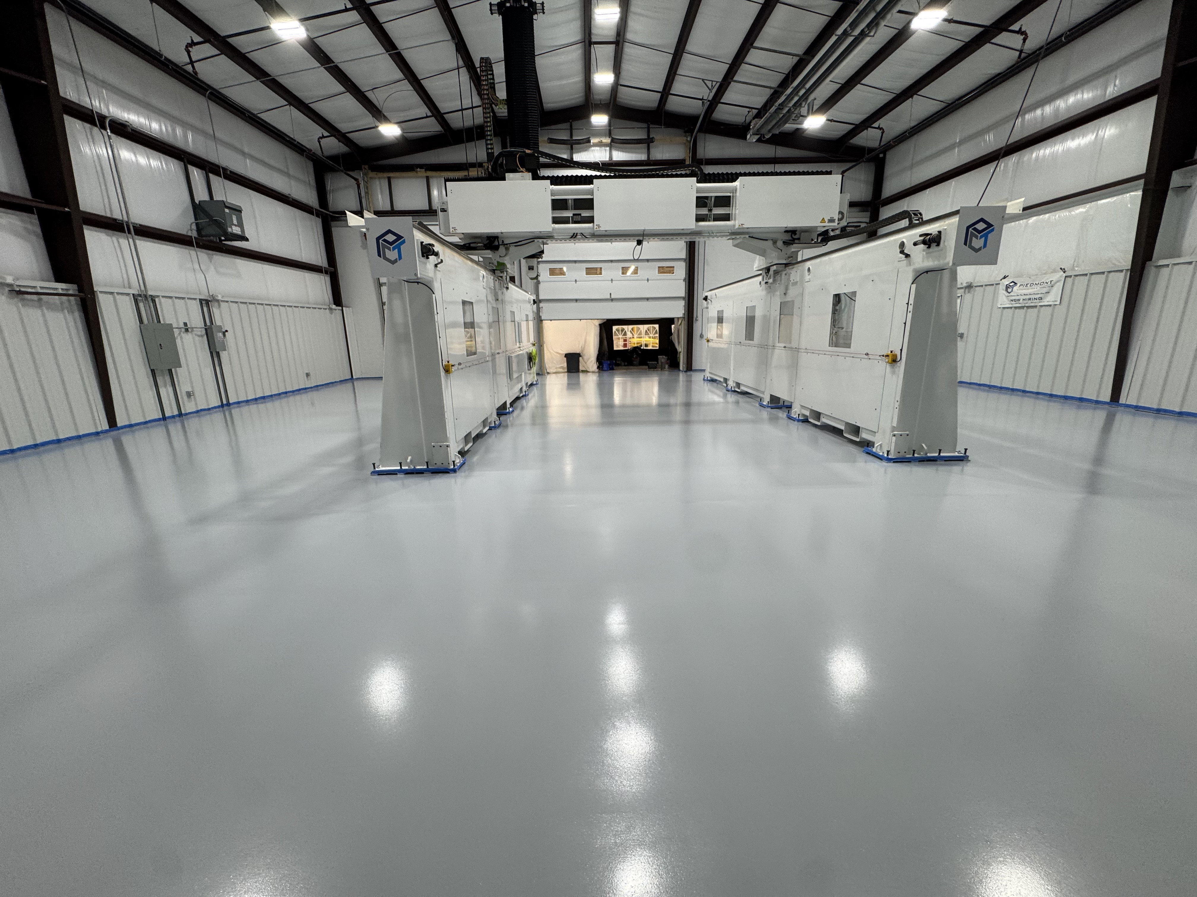 Large commercial facility with a finished gray epoxy floor coating